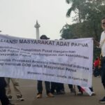 Aliansi Masyarakat Adat Papua (AMAP) menggelar aksi Patung Kuda Amnesty Internasional Stop Berpolitik